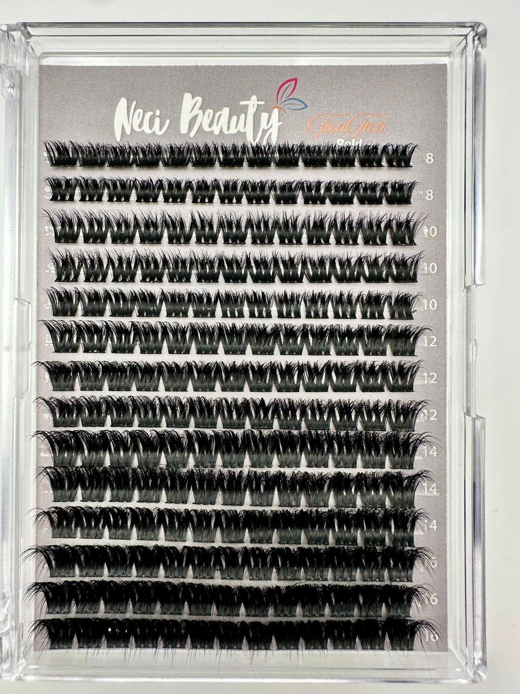 Eyelash extension tray with multiple rows of false eyelashes on a gray background